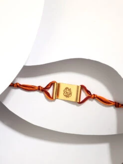 Suhani Pittie Gold Toned Ganesh Pin Rakhi