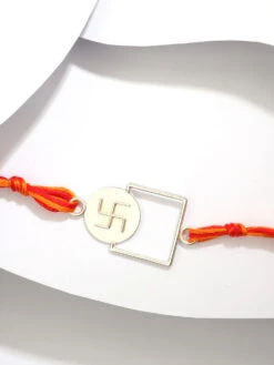 Suhani Pittie Silver Tone Rakhi With Swastika Motif