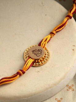 Suhani Pittie Gold Plated Embellishment Rakhi With Ganesha Detailing
