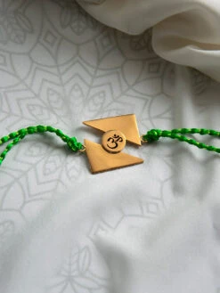 Suhani Pittie Gold Plated Triangular Rakhi With An Om